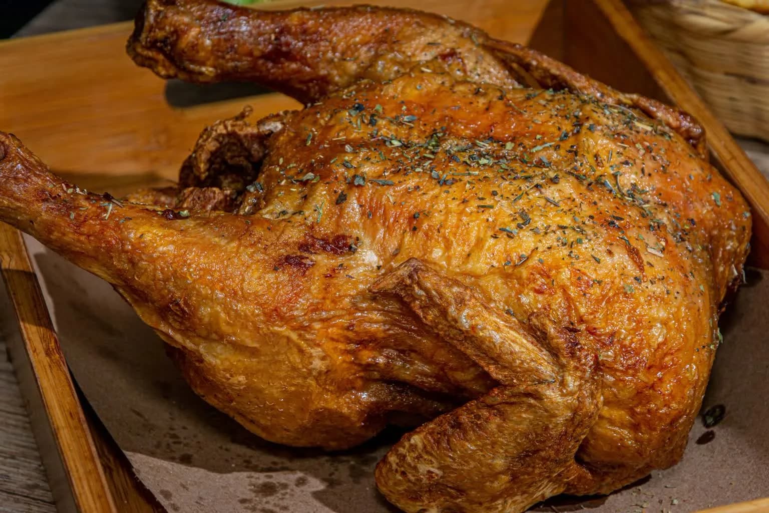 A whole roast chicken with golden, crackling skin